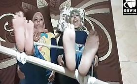 Arabic Soles bastinado feet of 2 Hijab women